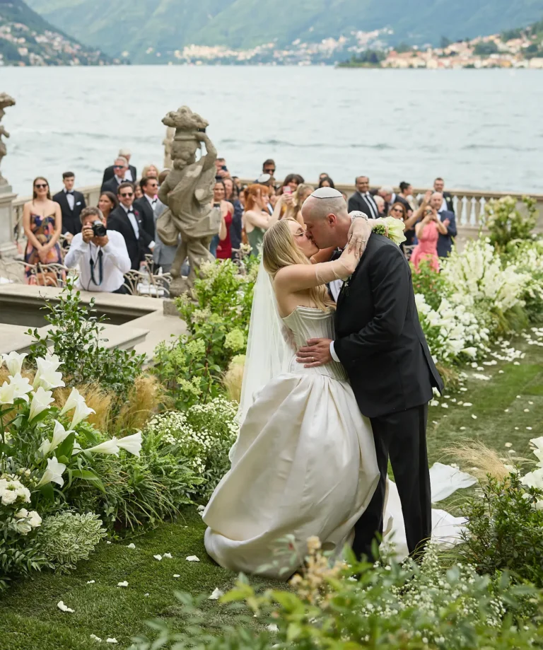 the extraordinaire lake como first kiss after ceremony by water
