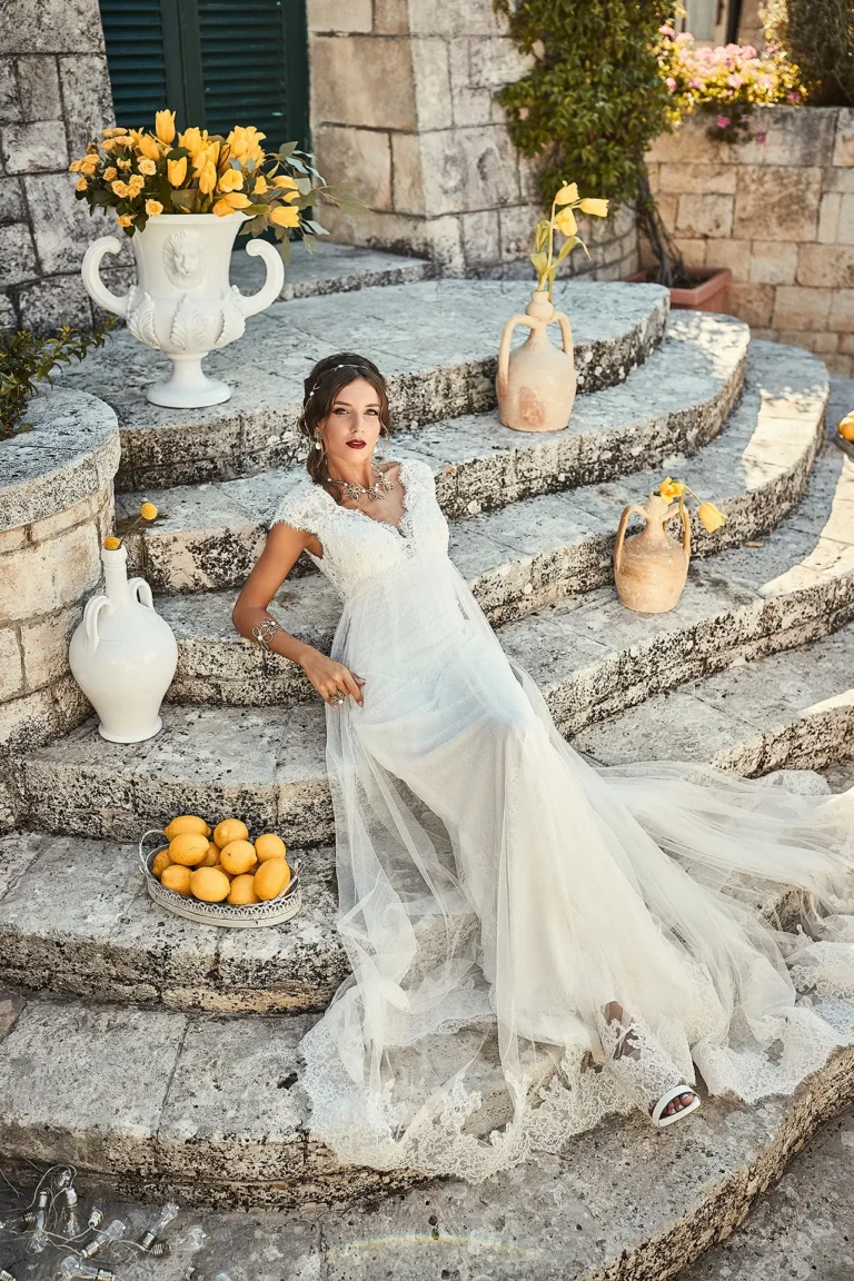 the extraordinaire puglia bridal lying on steps yellow accents