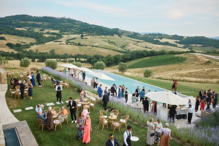 the extraordinaire tuscany podere tesoro after ceremony cocktails in pool area