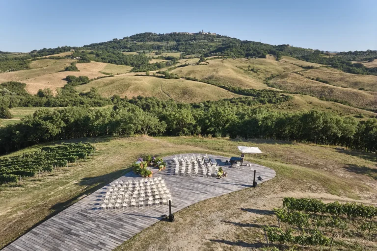 the extraordinaire tuscany podere tesoro drone view ceremony area at end of walkway close up