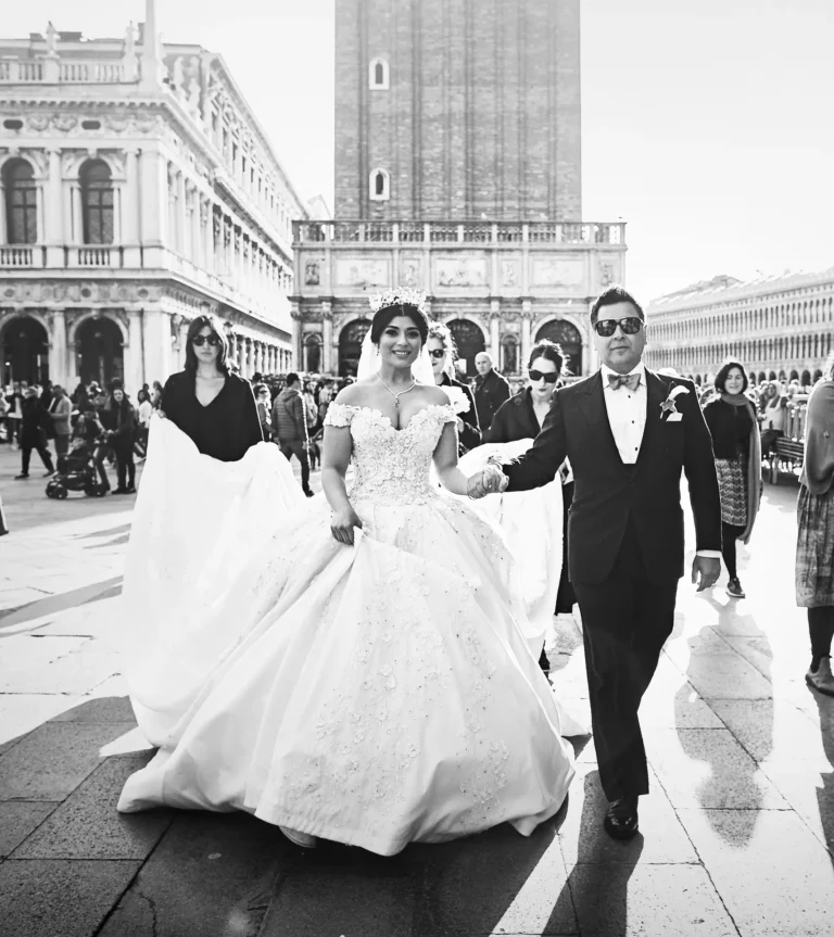 the extraordinaire venice stylish couple walking in san marco square